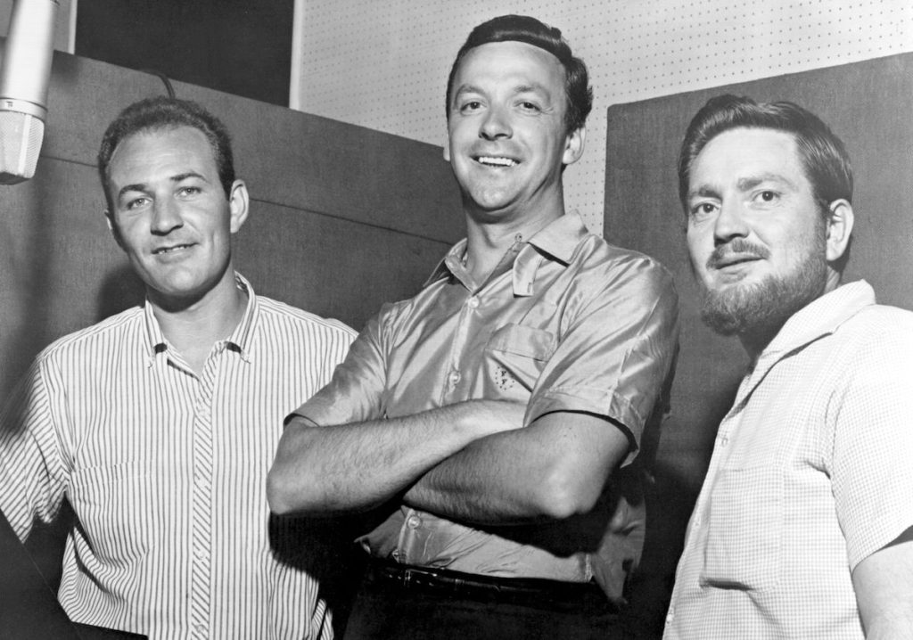 Fred Foster, president of Monument Records, poses with his newest signees, Fred Carter (left) and Willie Nelson in circa 1960