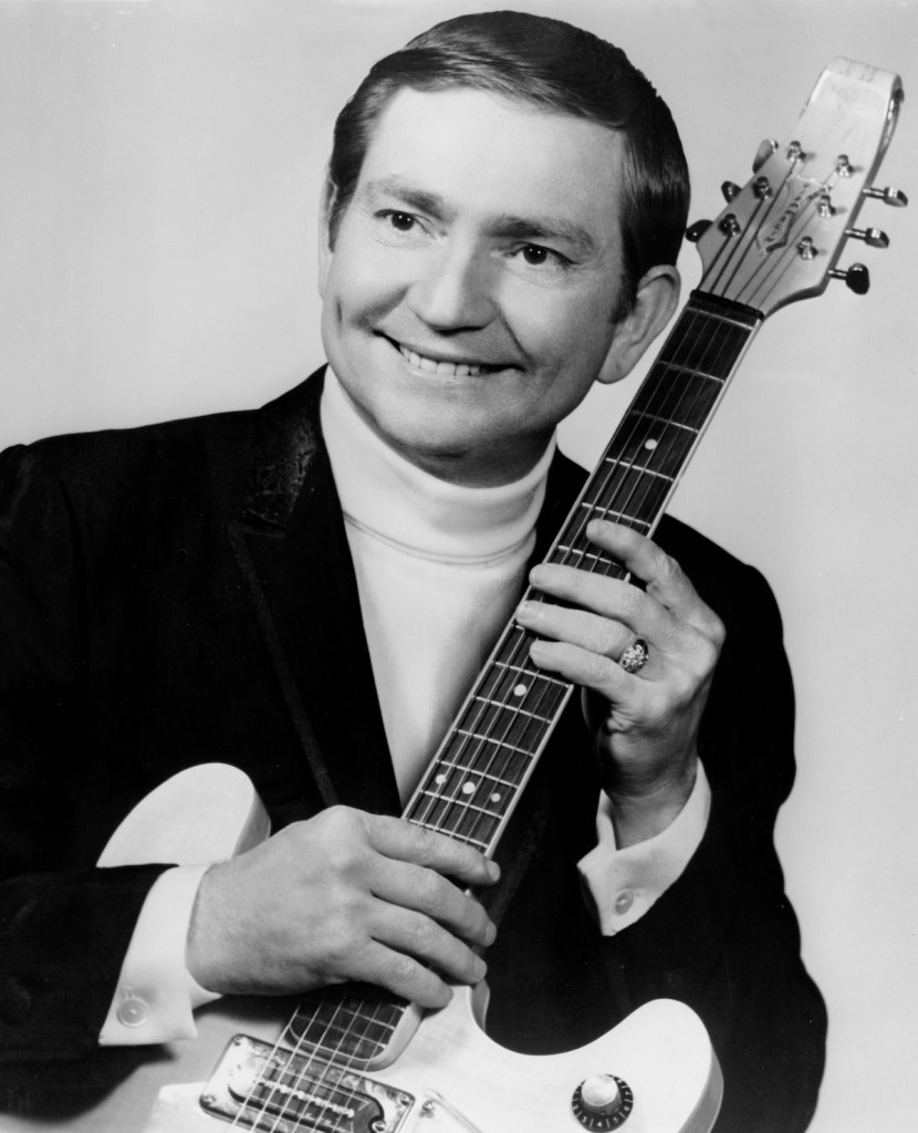 Country singer/songwriter Willie Nelson poses for a portrait with an electric guitar in circa 1967