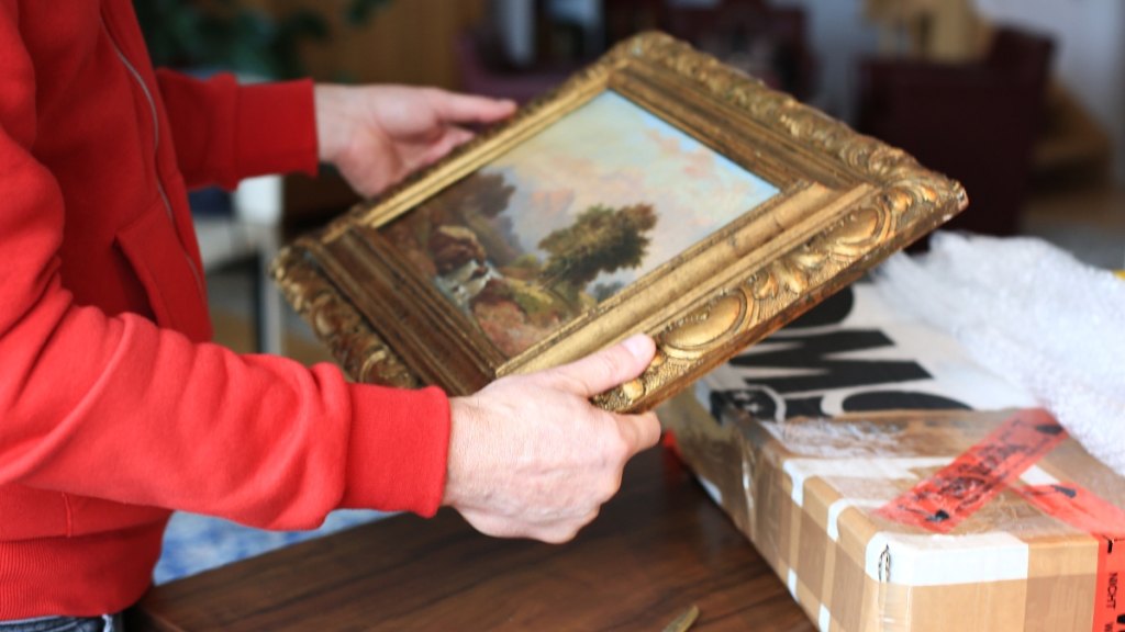 A painting in a gold frame