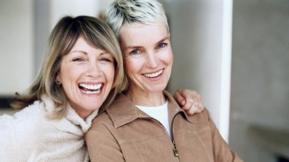Two female friends smiling