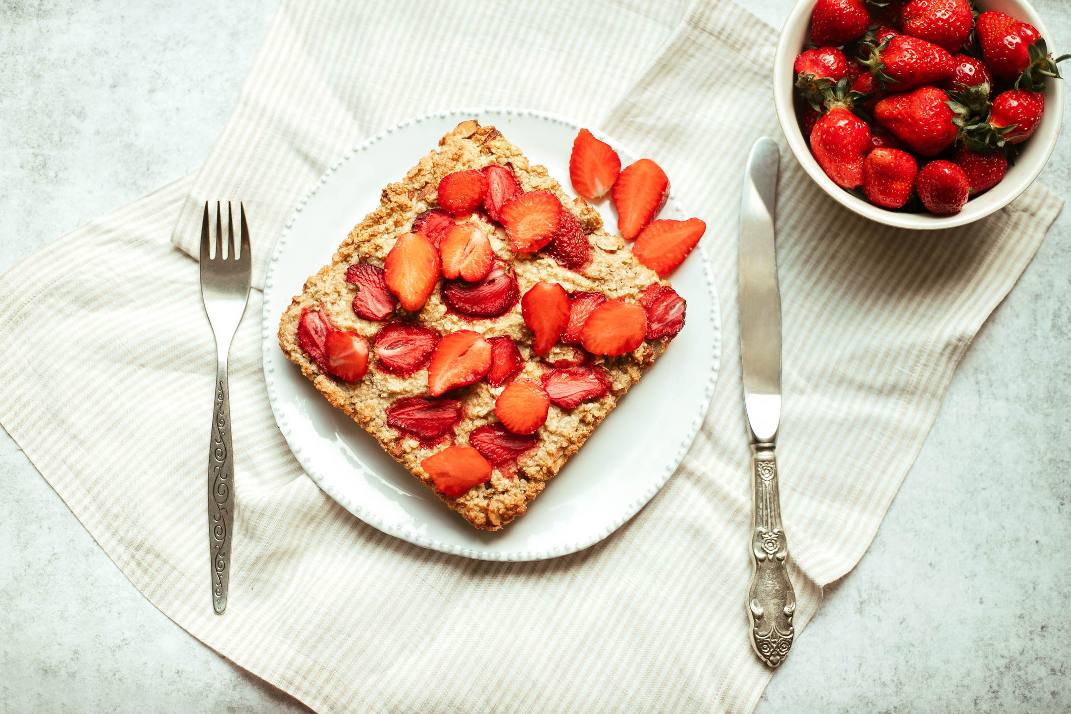 Strawberry cheesecake baked oatmeal on plate