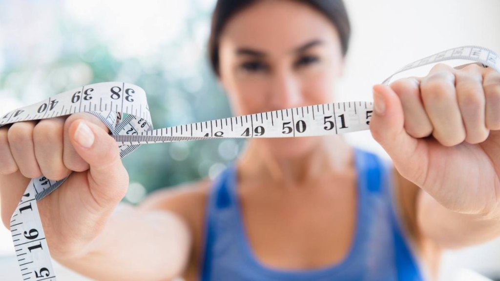 Woman with measuring tape