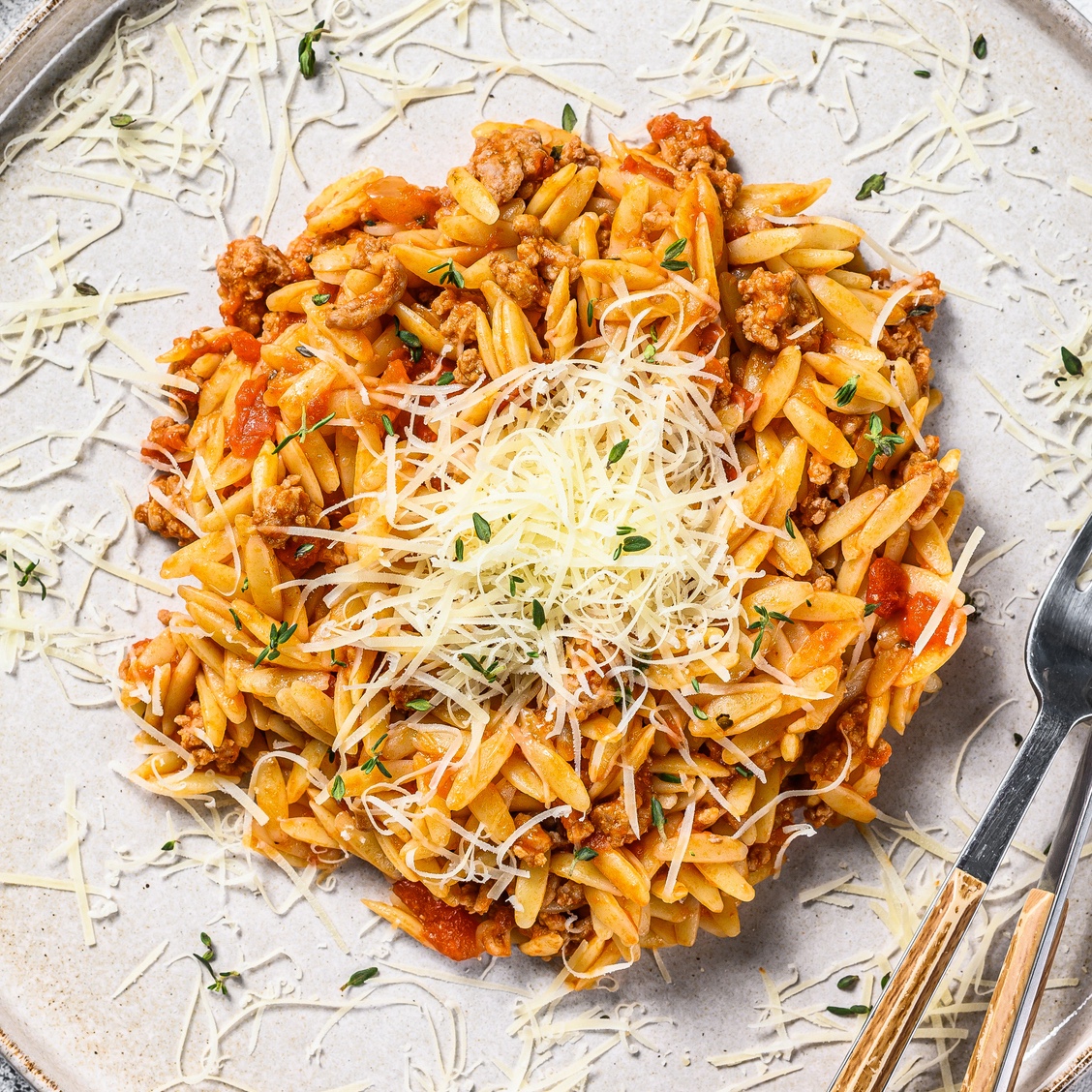 One-pot orzo pasta with Parmesan cheese on top
