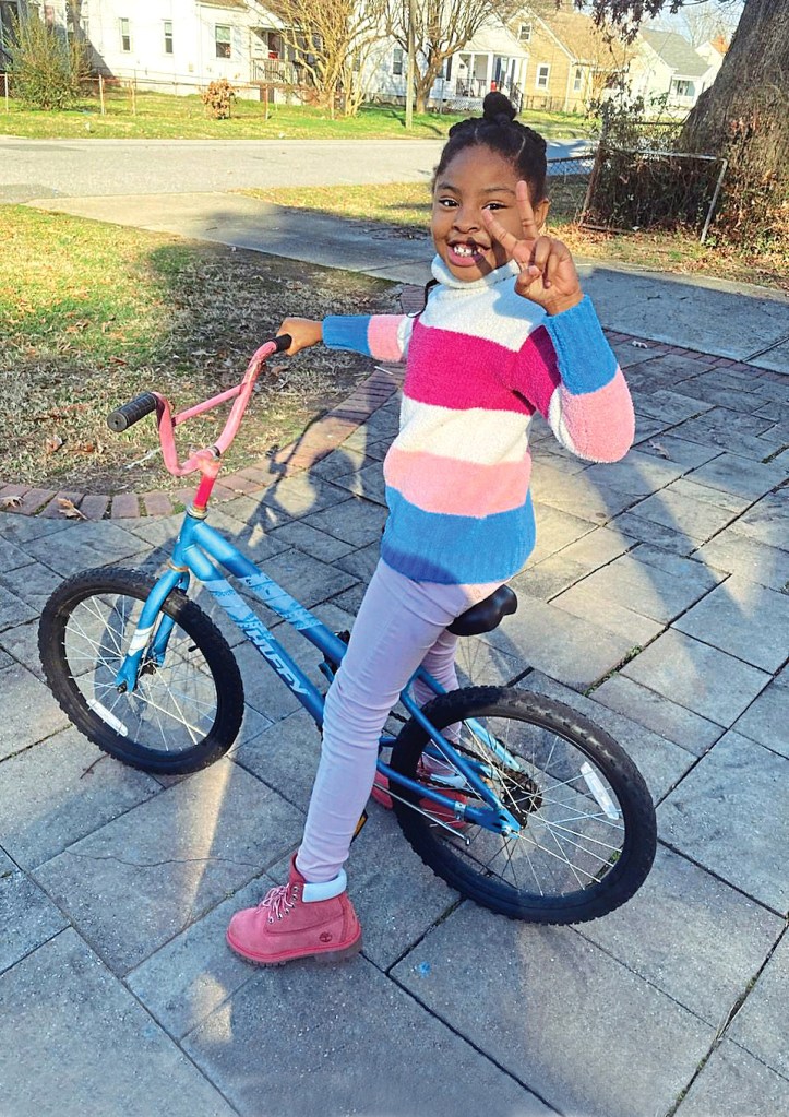 For many kids, a bike is a dream gift, and their excitement shows in their huge smiles