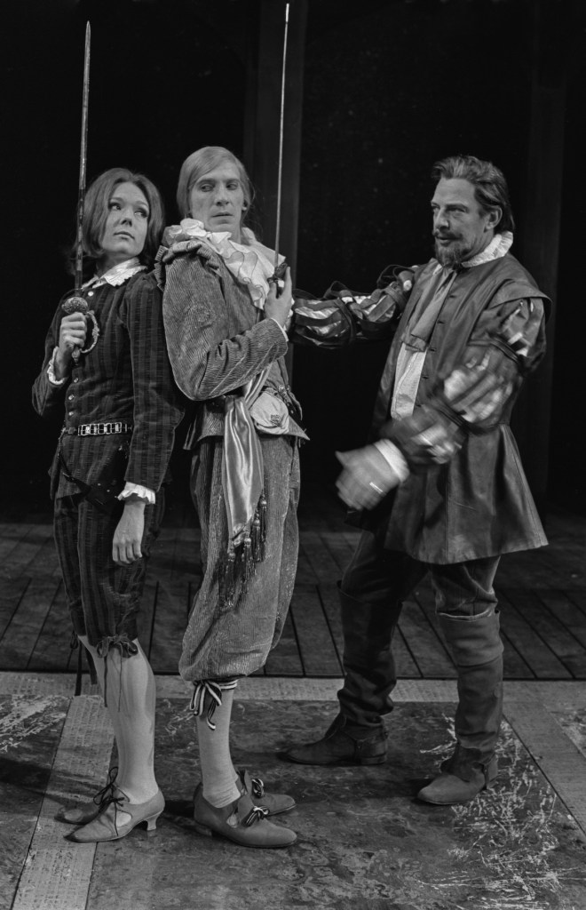 From left to right, British actors Diana Rigg as Viola, David Warner as Sir Andrew Aguecheek and Brewster Mason as Sir Toby Belch, in the duel scene from Shakespeare's 'Twelfth Night', a Royal Shakespeare Company production at Stratford-Upon-Avon, UK, June 1966