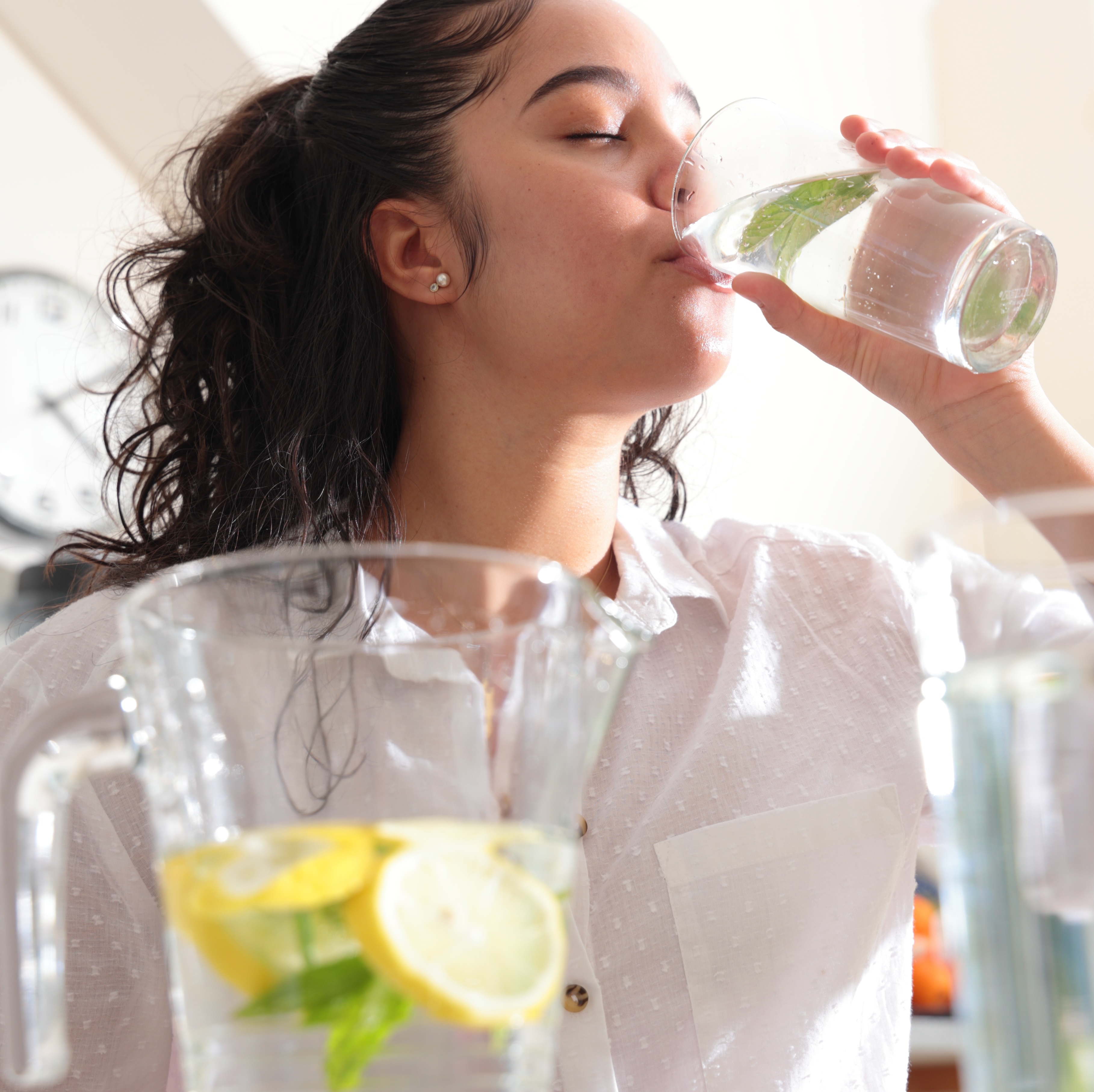 Woman drinking lemon water