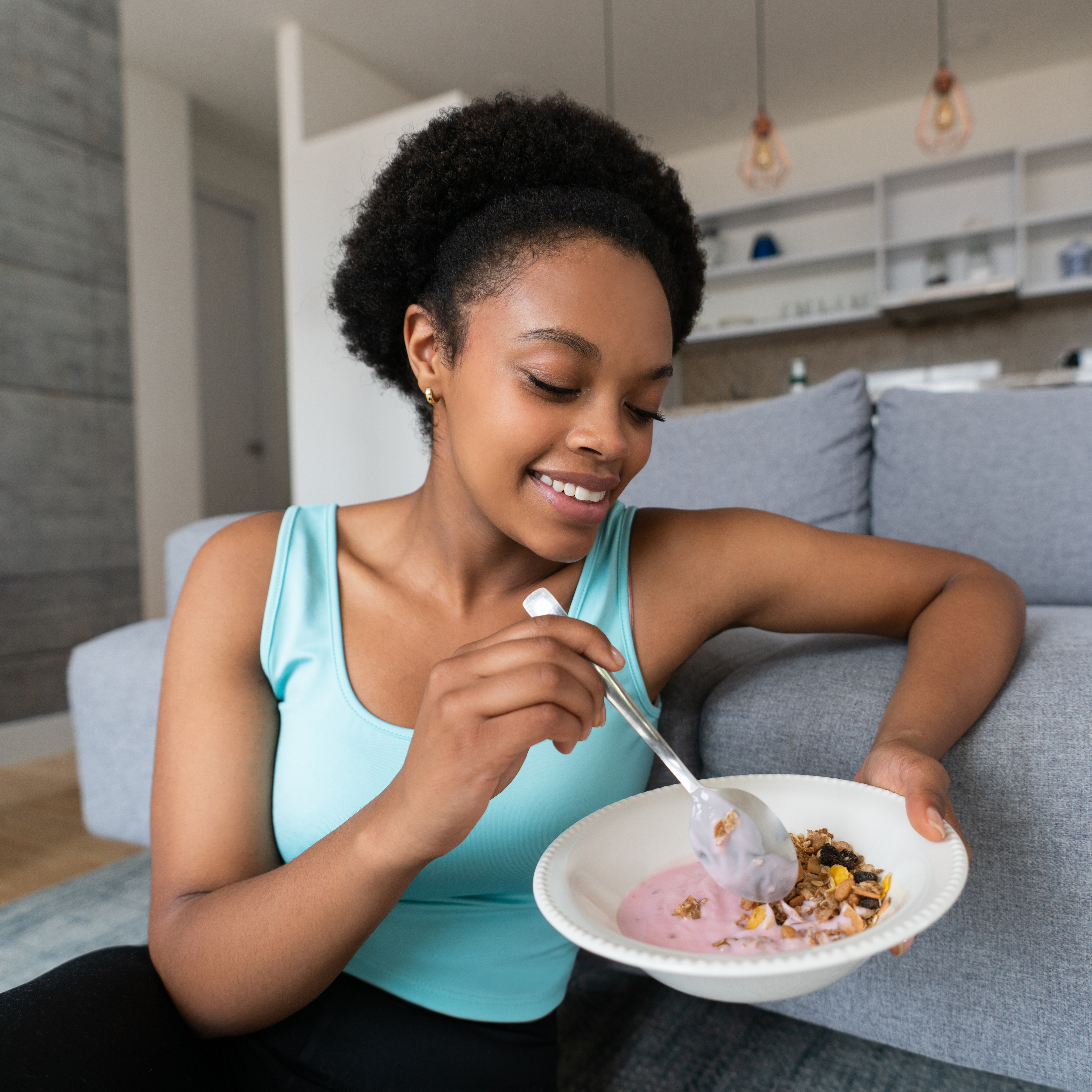 Black woman eating yogurt