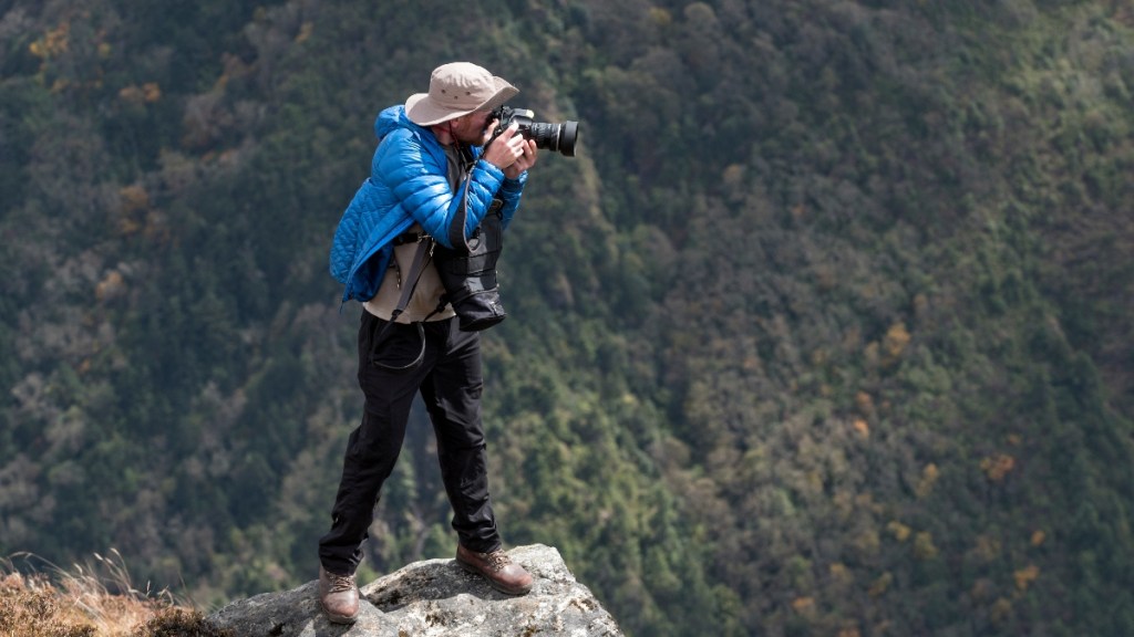 A photographer standing like a tripod