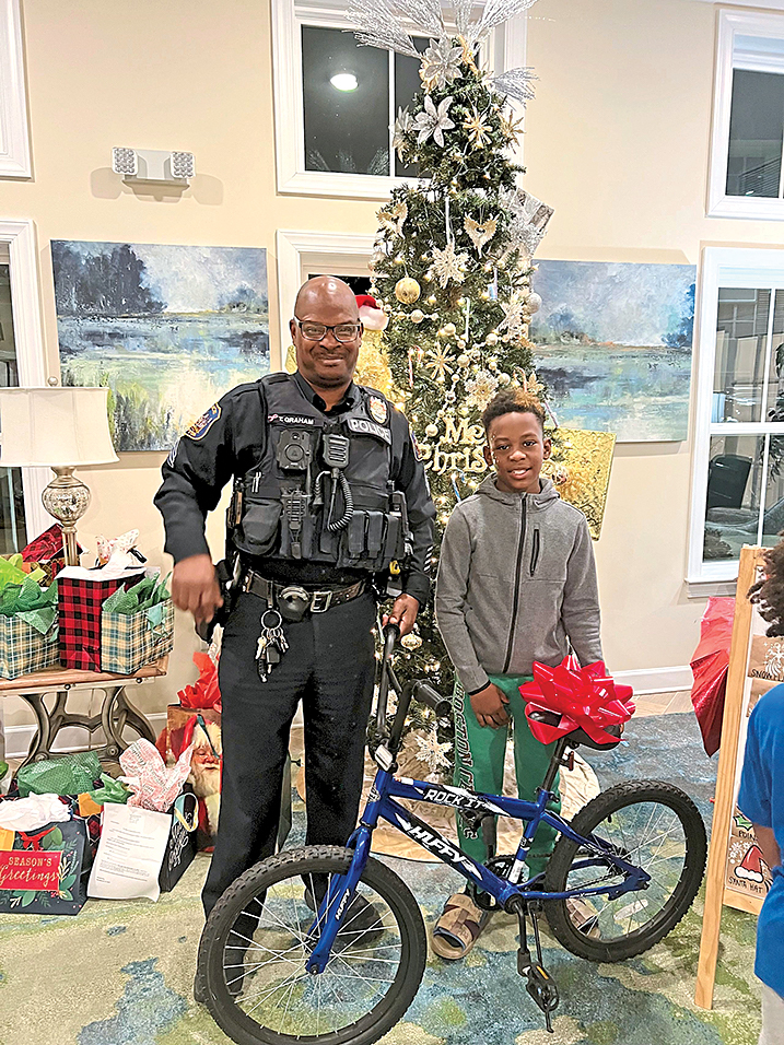 Even local police officers help with giveaways
