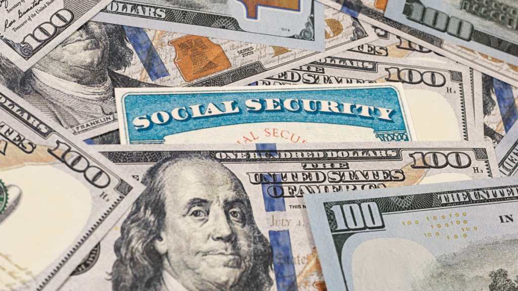 A Social Security card surrounded by money
