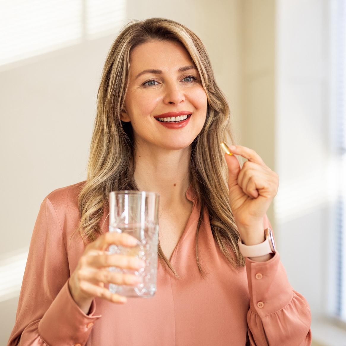 mature woman taking a zinc lozenge to treat awkward health hassles like bad breath