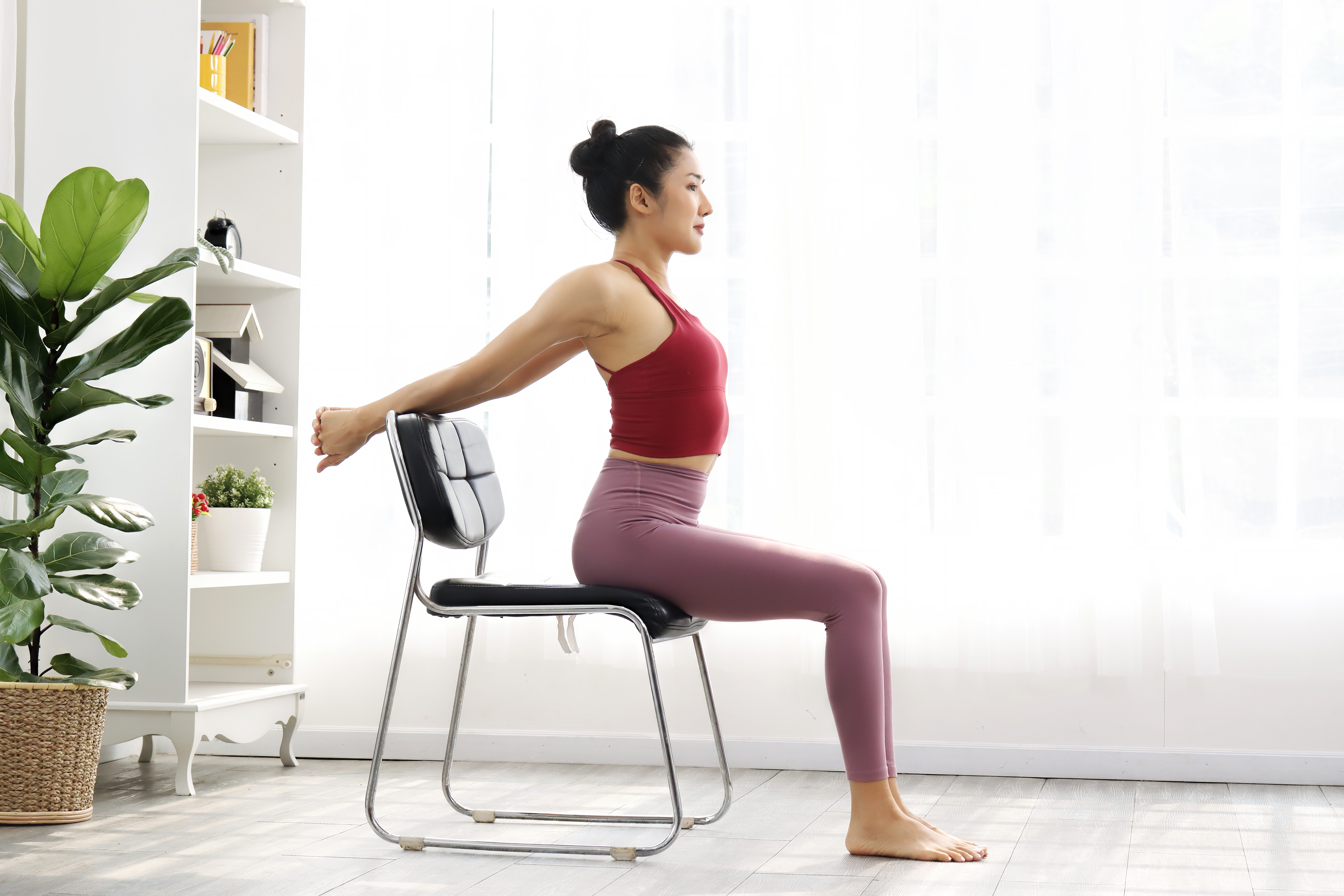 Woman doing chair yoga