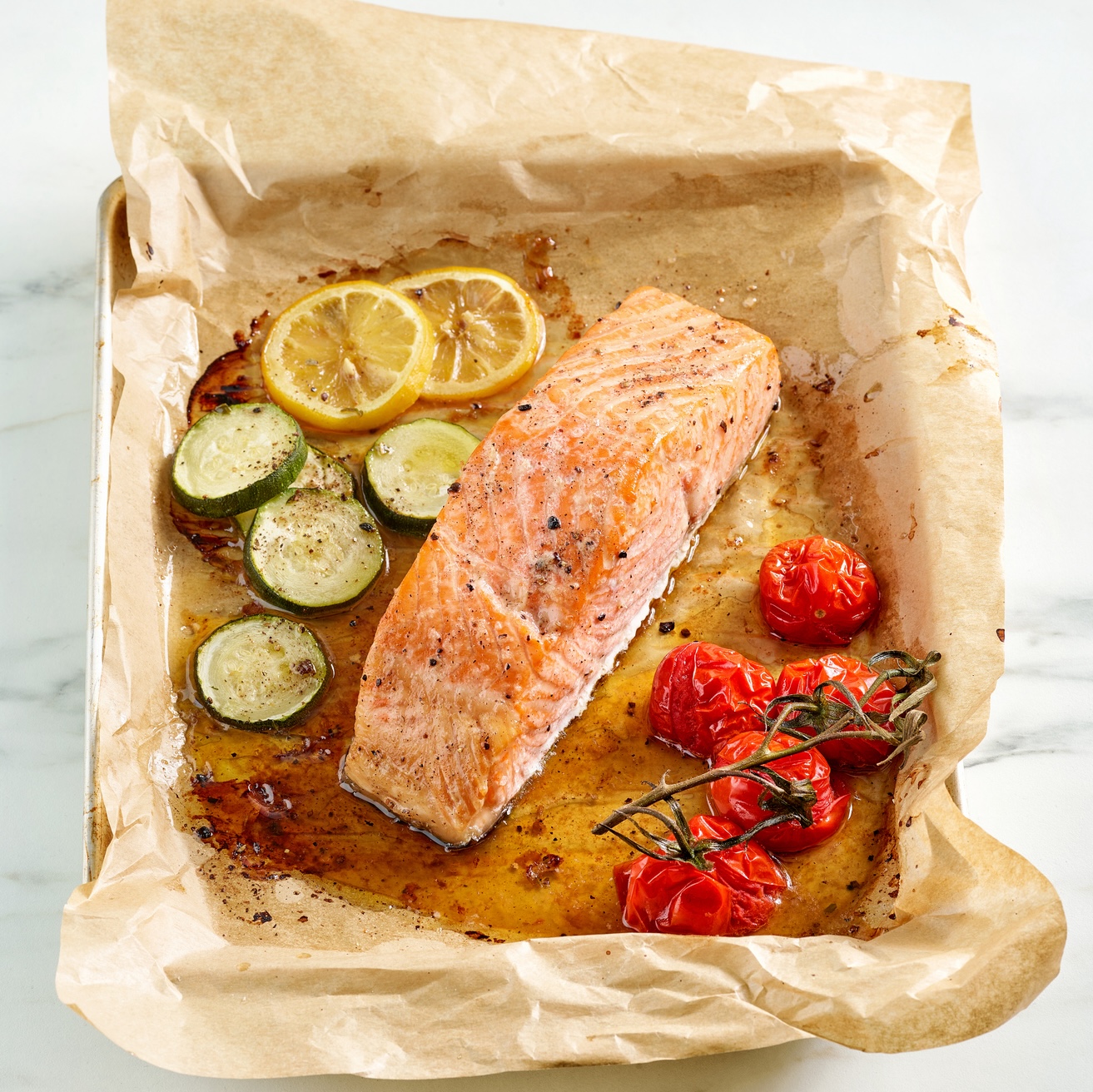 Sheet pan salmon with cherry tomatoes and zucchini