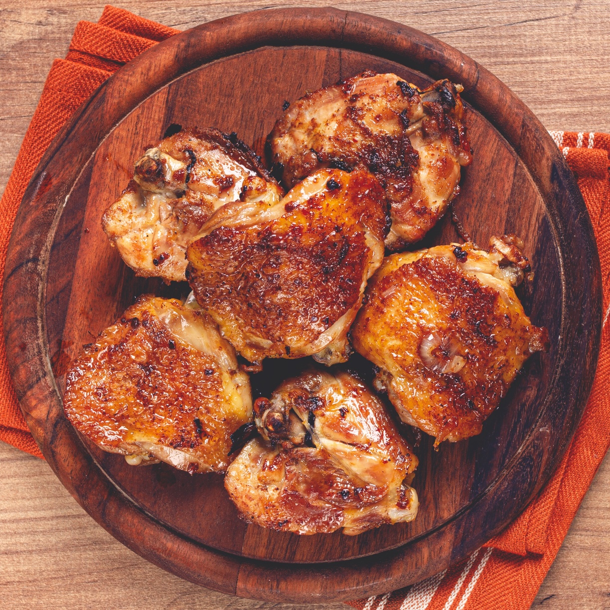 sweet tea oven-fried chicken recipe from Katie Lee Biegel on wooden plate