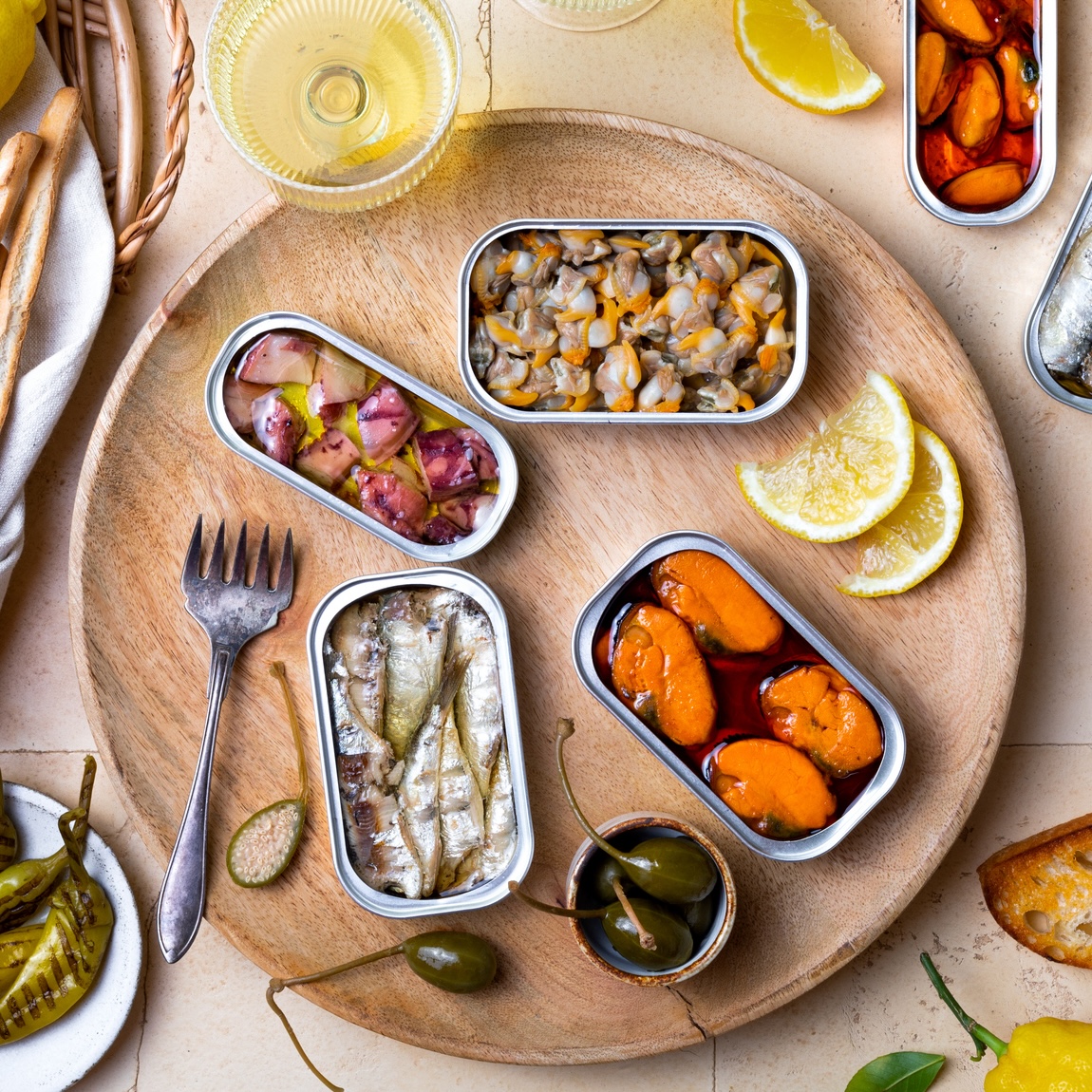Tinned fish snack plate with canned fish and seafood.