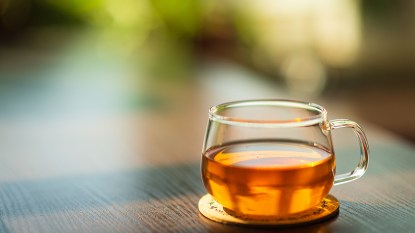 cup of tea on an outdoor table; benefits or oregano tea