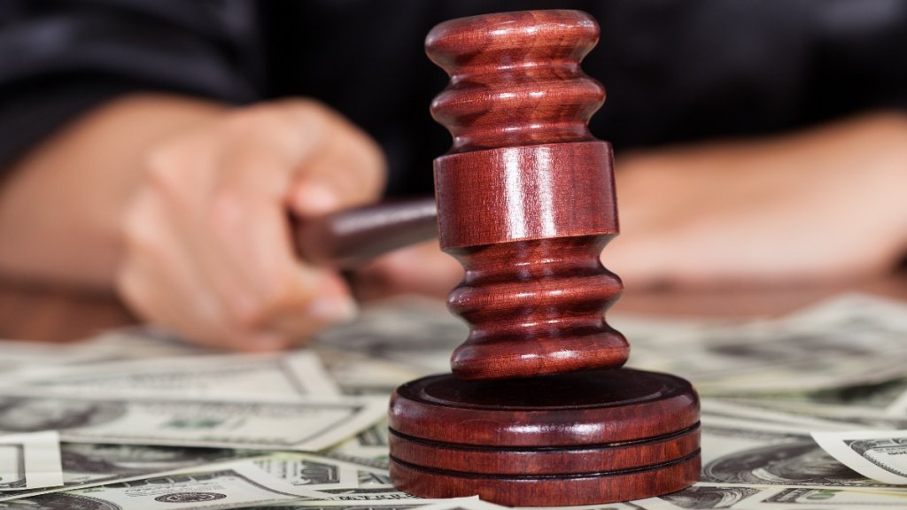 A gavel surrounded by cash