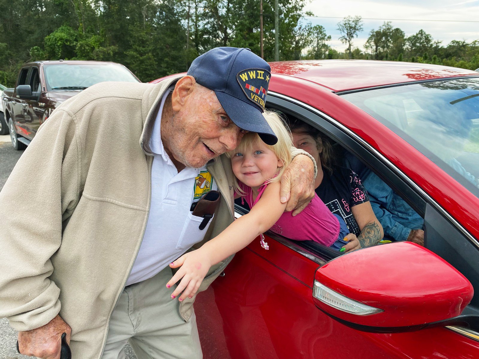 Bill Brown greeting families, the official Woman's World story image