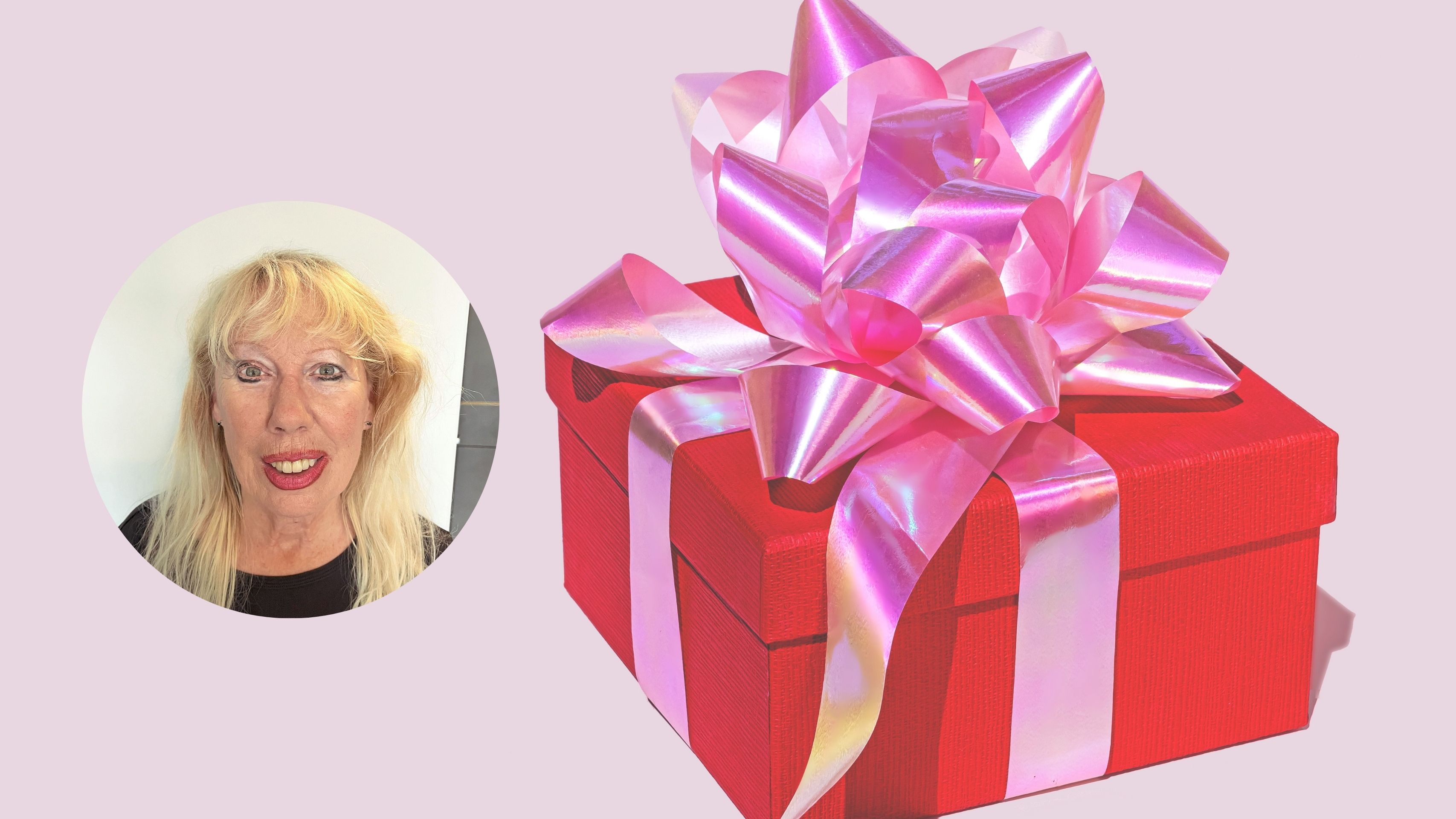 Red gift box against pink background