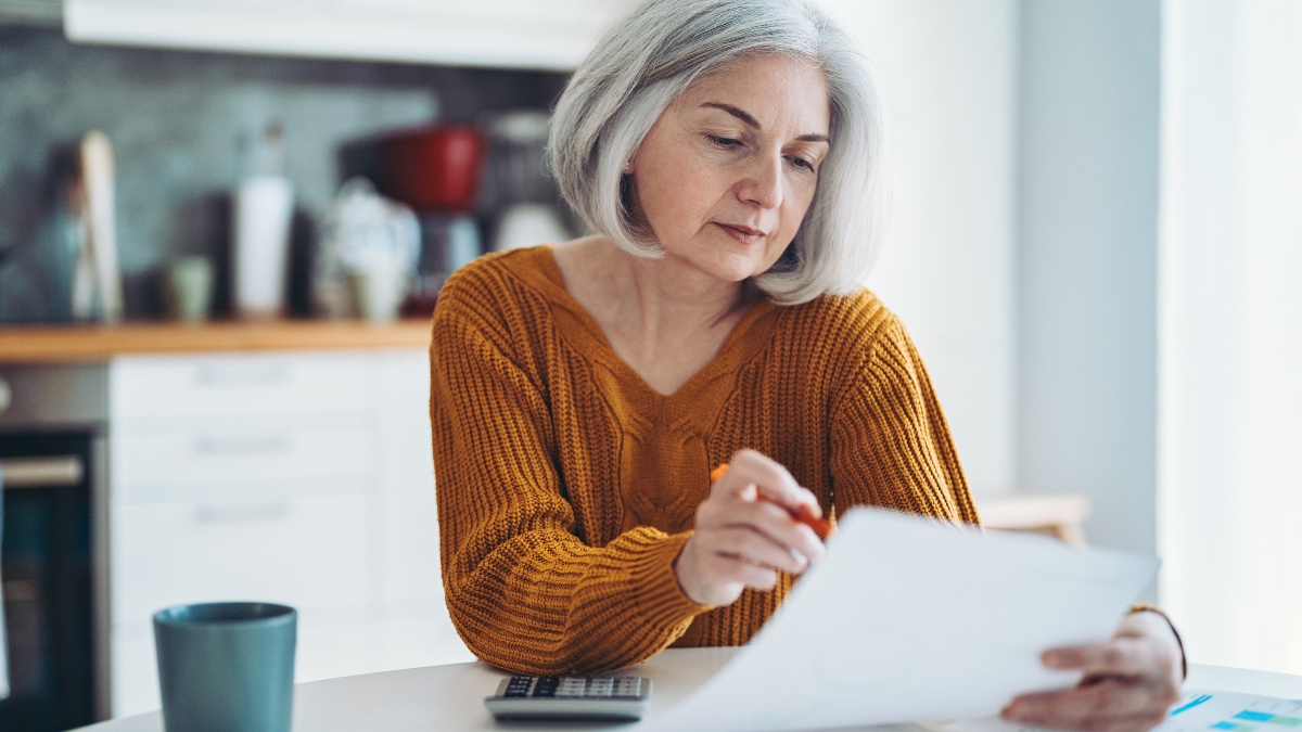 An older woman working on taxes