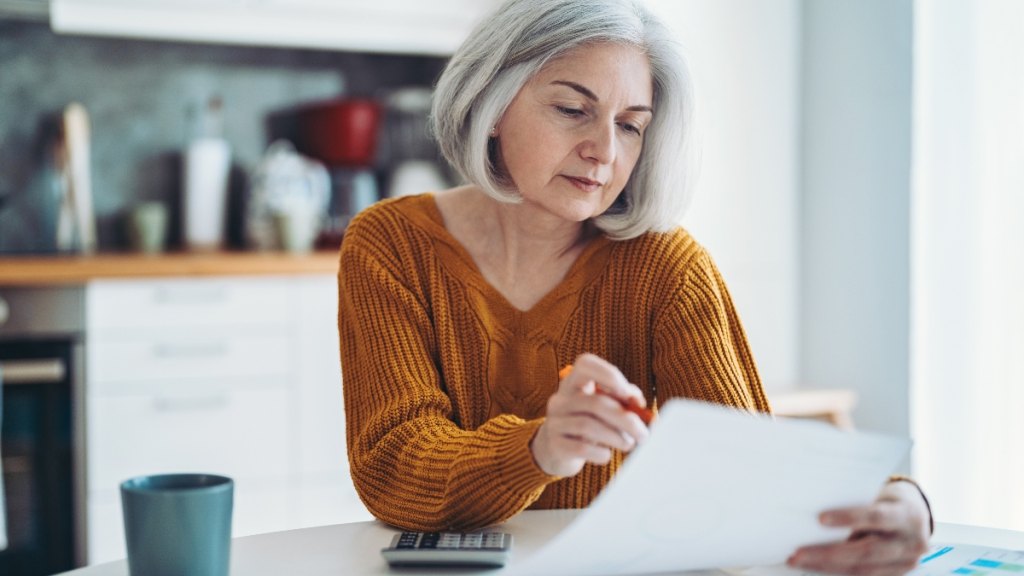 An older woman working on taxes