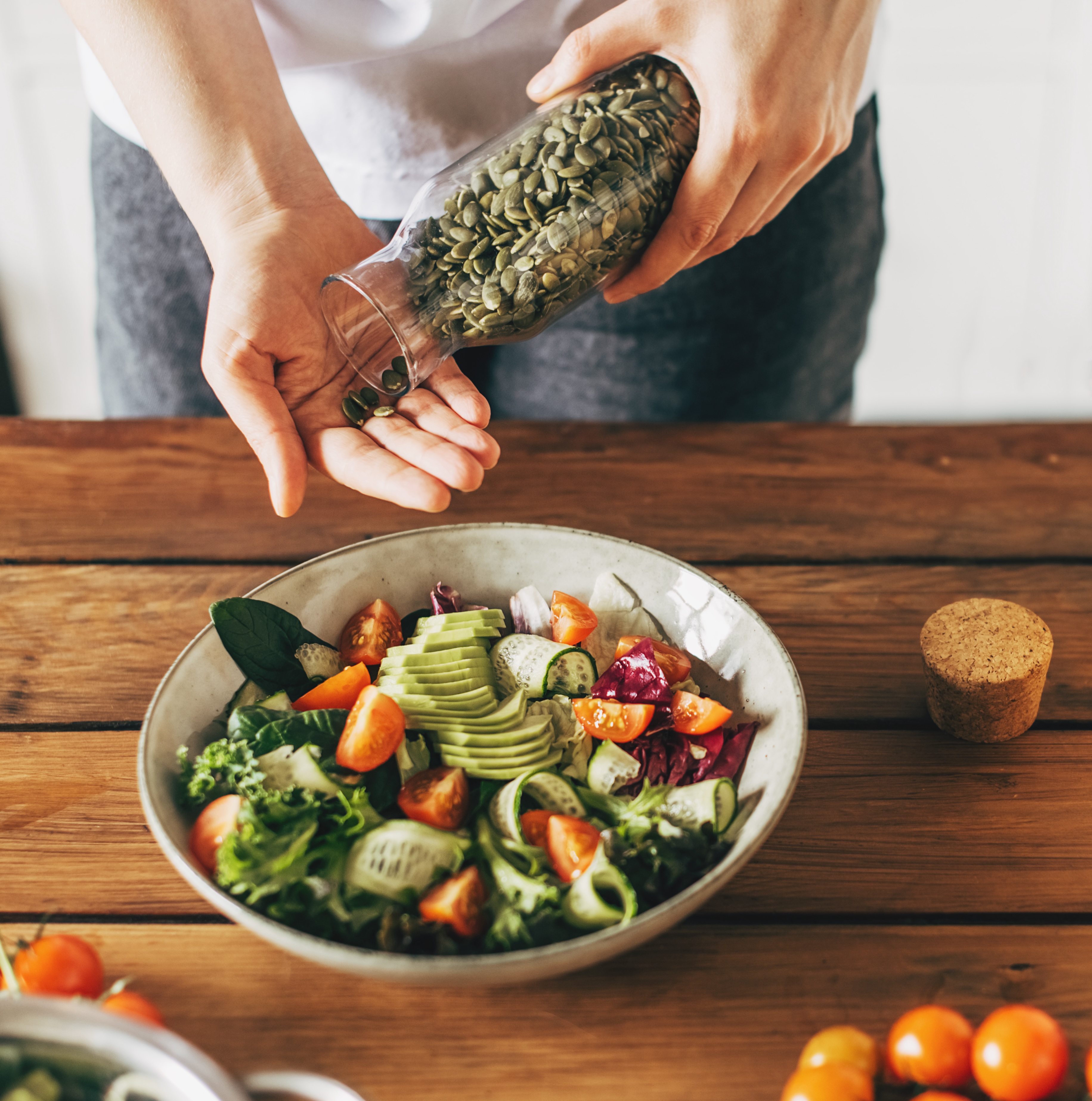 Woman eating salad and beans