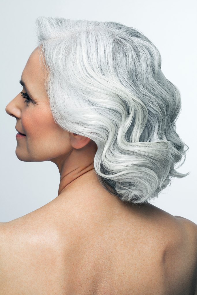 mature woman with grey hair beachwaves hairstyle