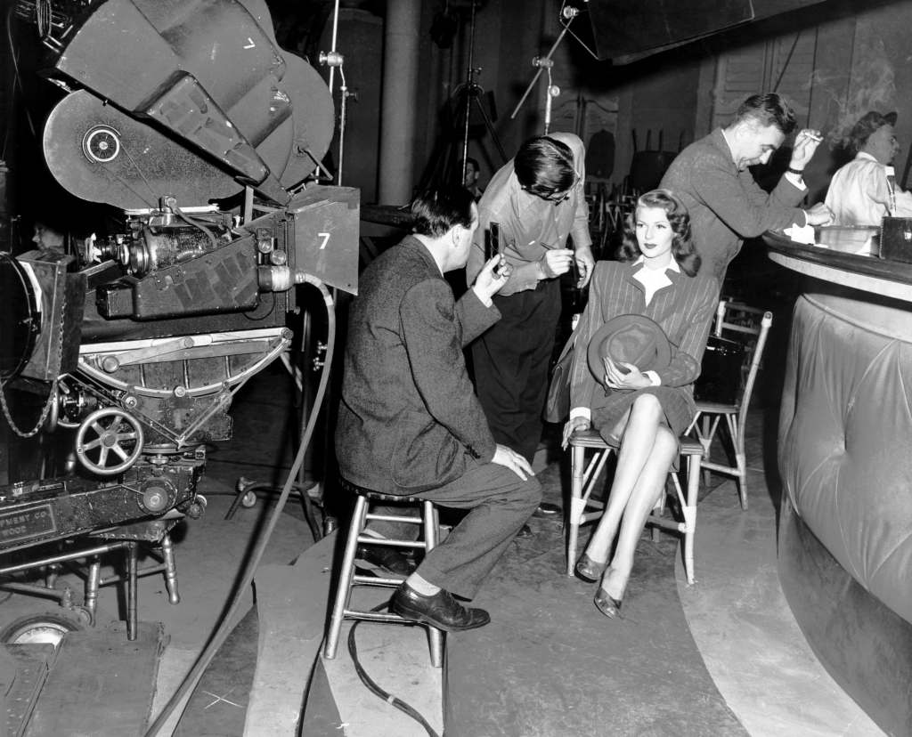 GILDA, from left, cinematographer Rudolph Mate, Rita Hayworth, director Charles Vidor, on-set, 1946