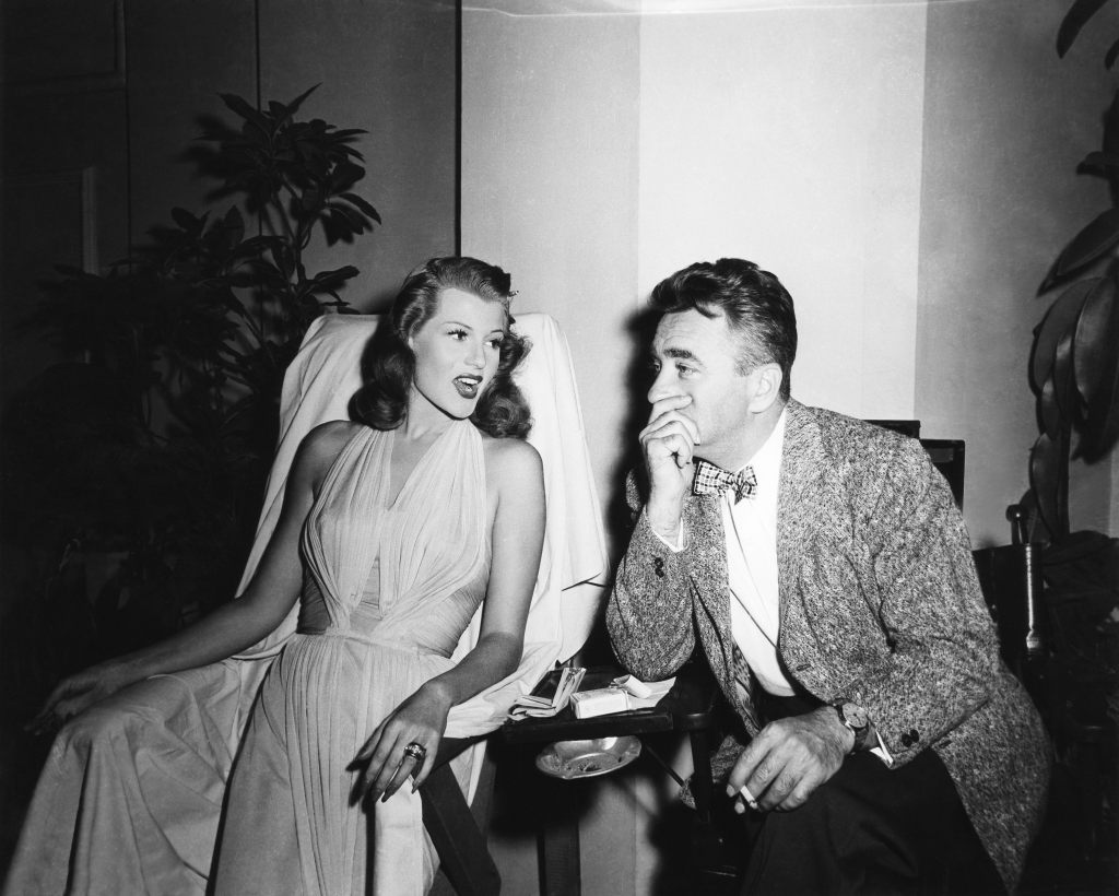 GILDA, from left: Rita Hayworth, director Charles Vidor, on set, 1946