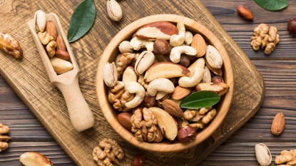 bowl of mixed nuts on a wooden board