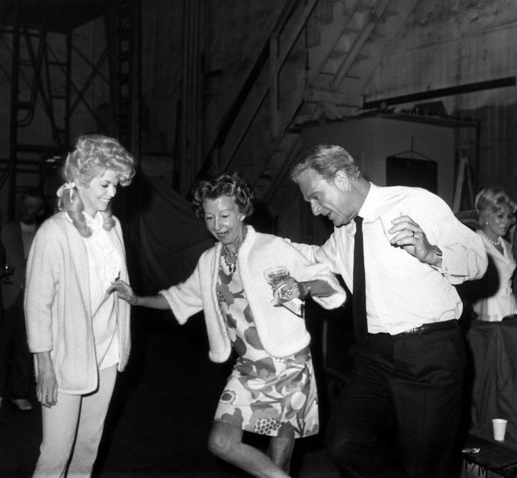 Donna Douglas, Irene Ryan, Eddie Albert, Eva Gabor(in background), cast party on set of Green Acres and The Beverly Hillbillies, 1965