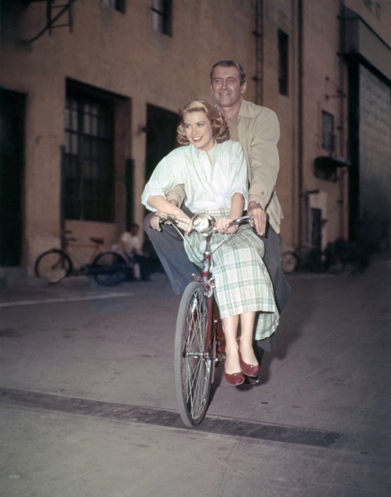 Grace Kelly and James Stewart on bike during filming of Rear Window