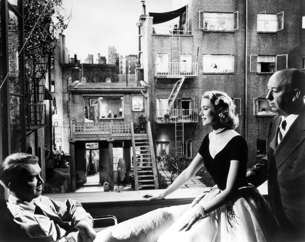 James Stewart, Grace Kelly and Alfred Hitchcock on the set of Rear Window