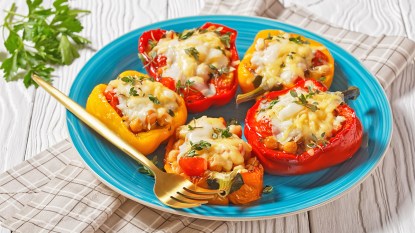 Vegetarian stuffed bell peppers served on a blue plate
