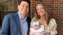 Alex Drummond holding daughter Sofia with husband Mauricio Scott