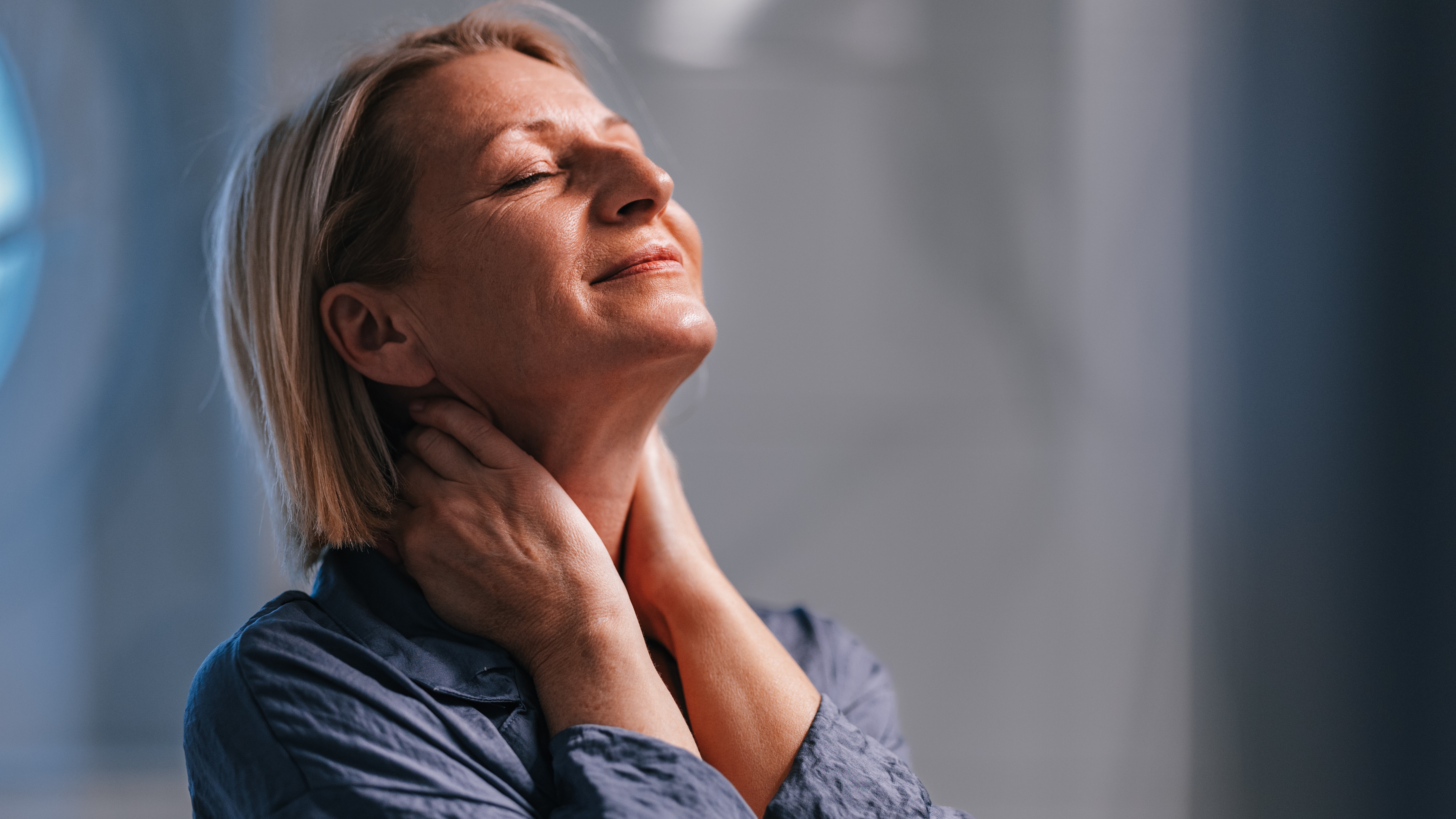 Woman massaging her neck