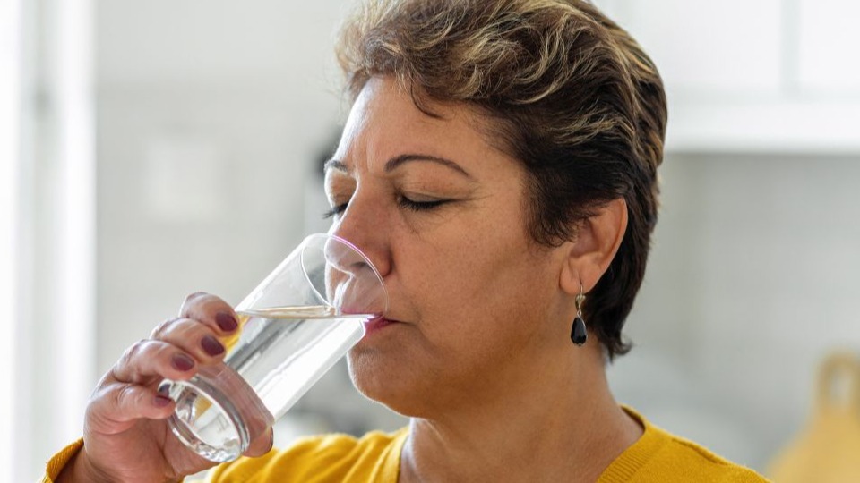 woman drinking glass of water