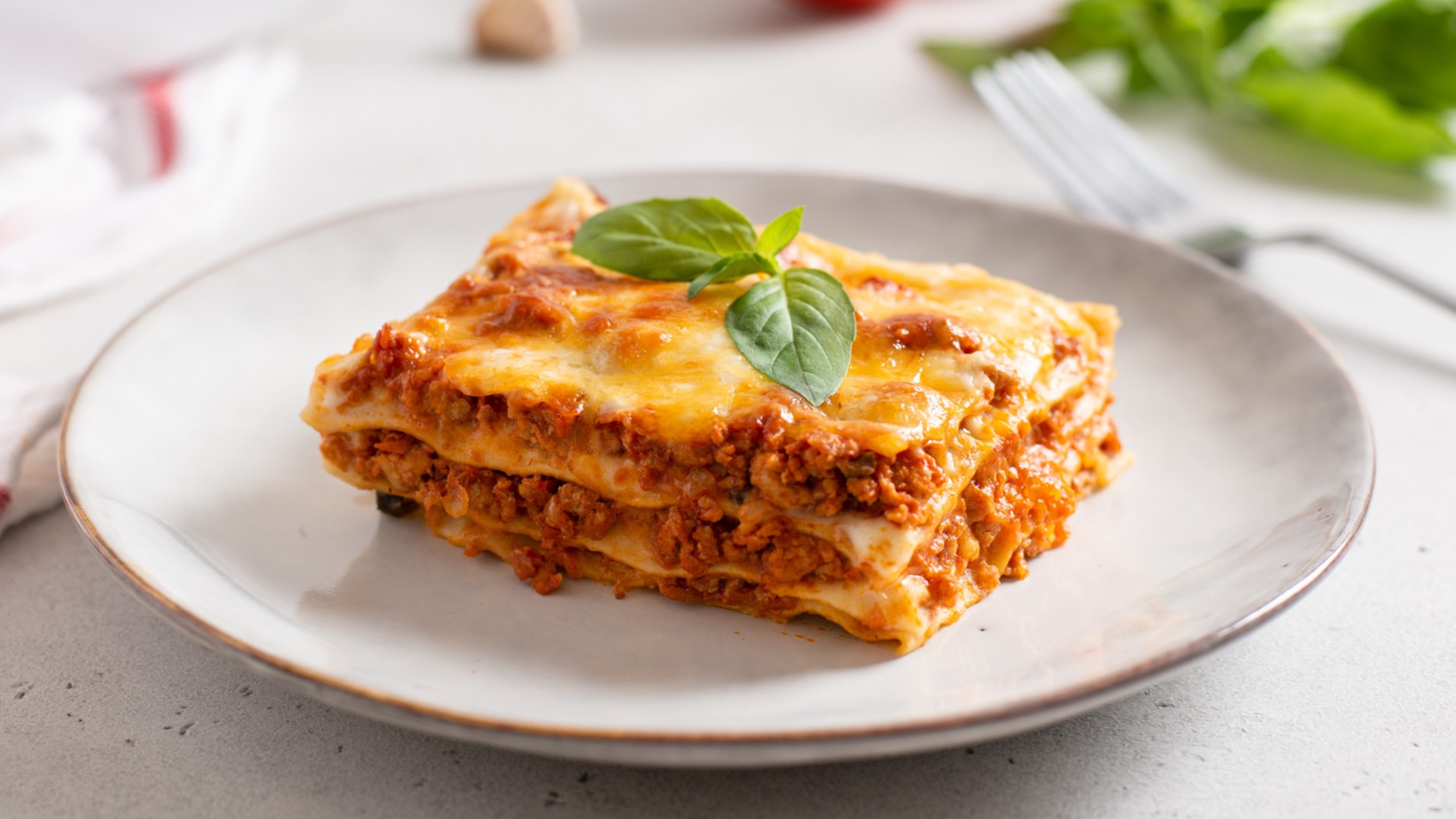 piece of Trisha Yearwood's famous cowboy lasagna with pepperoni and ricotta cheese