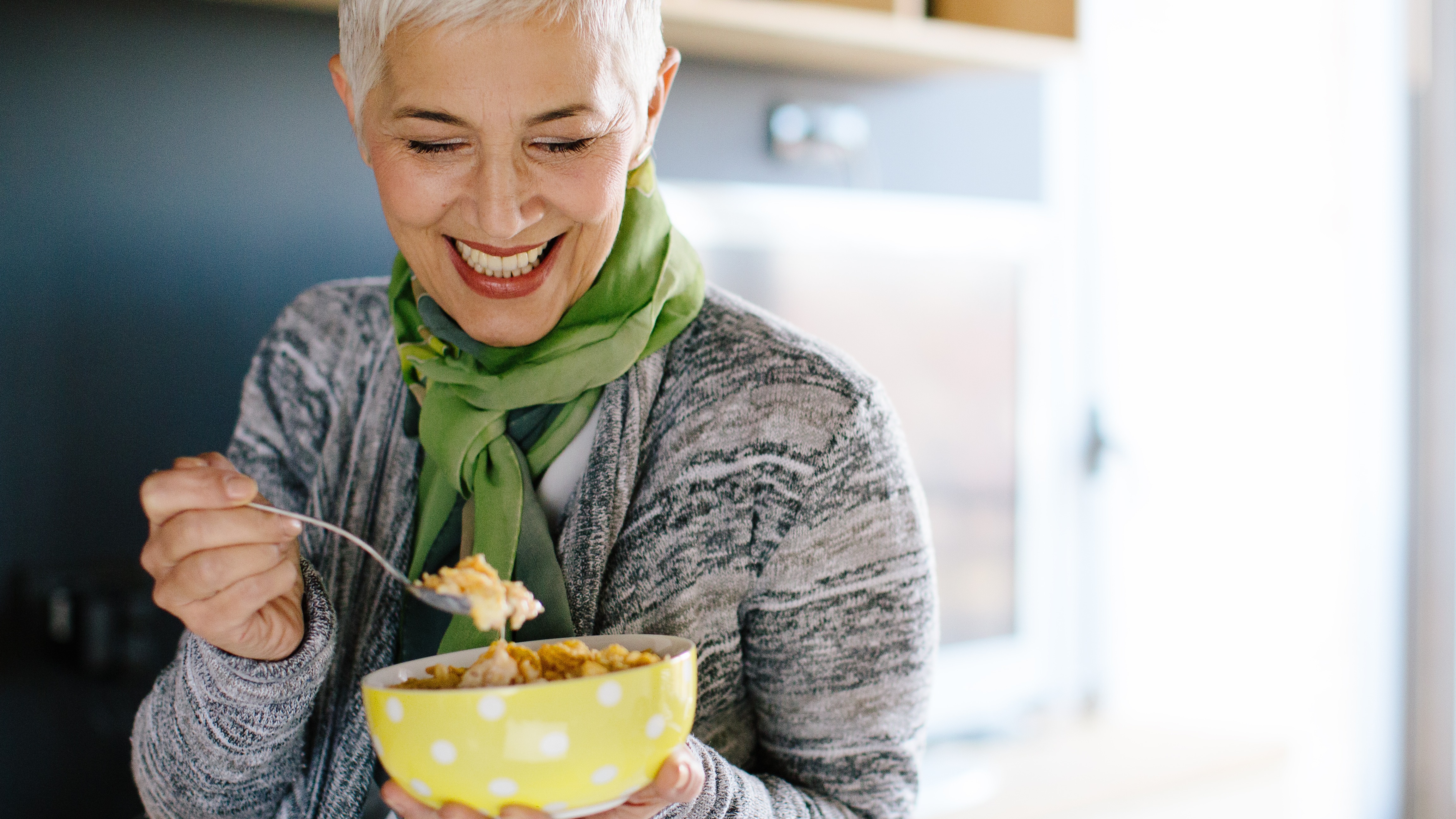 Woman eating oatmeal in the morning