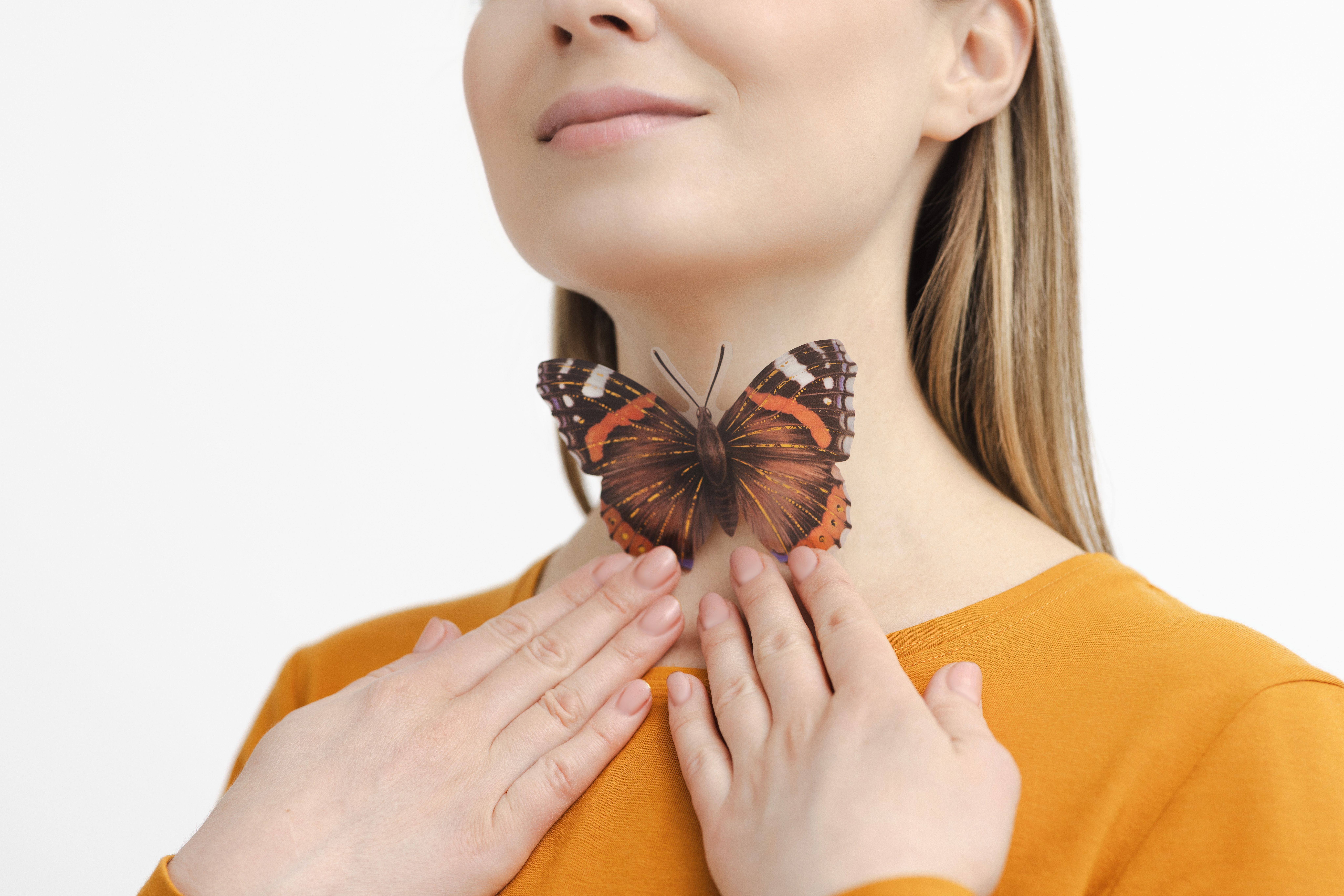 Picture of a woman with a butterfly on her neck