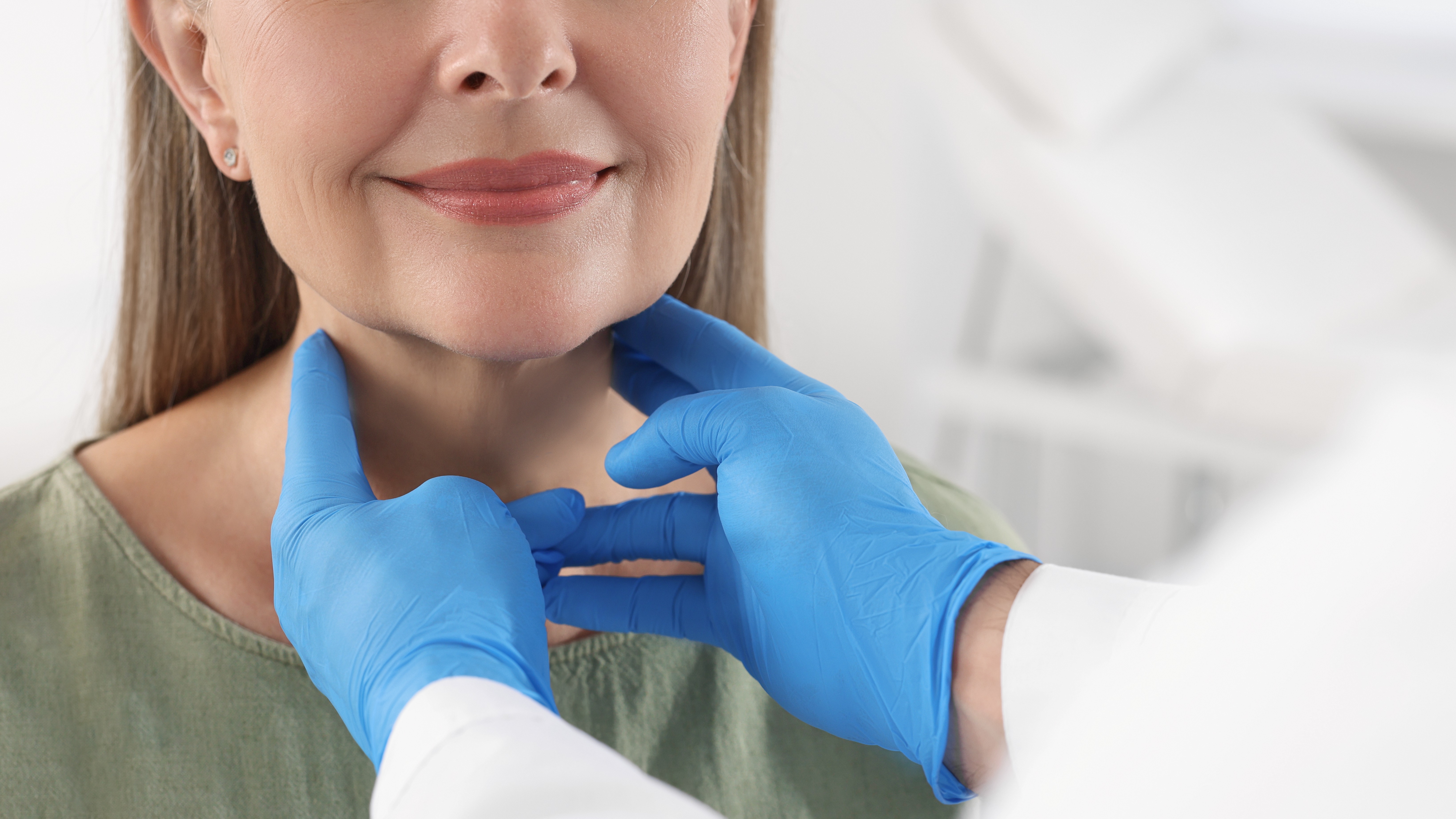 Woman getting thyroid checked