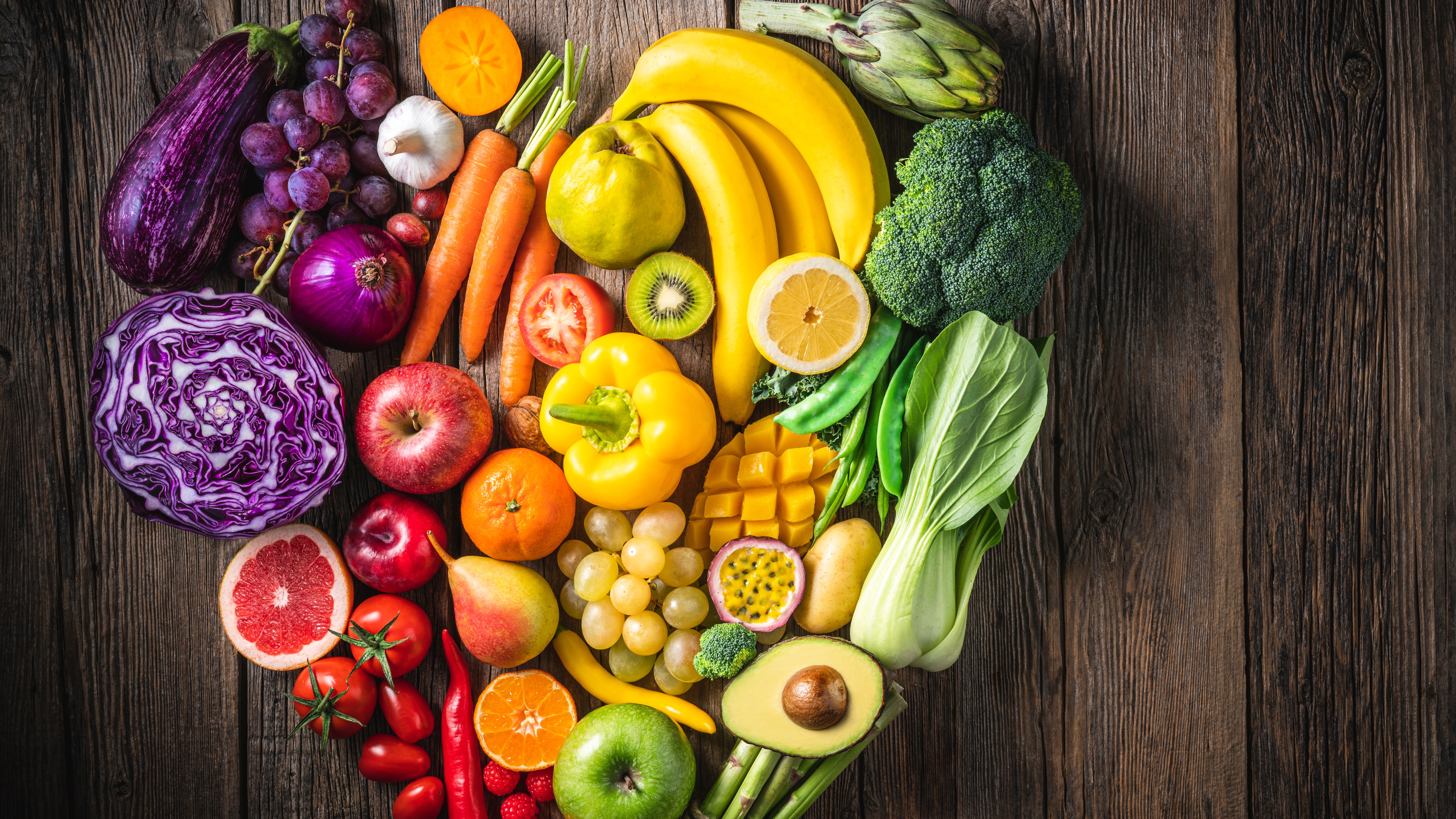 Colorful fruits and vegetables in a heart