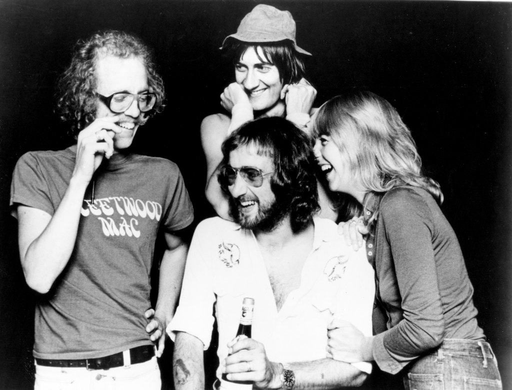 8 band members laughing