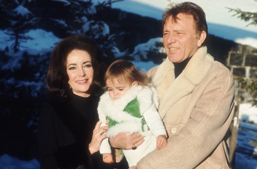 Elizabeth Taylor and Richard Burton with her granddaughter, Laela Wilding, in 1973