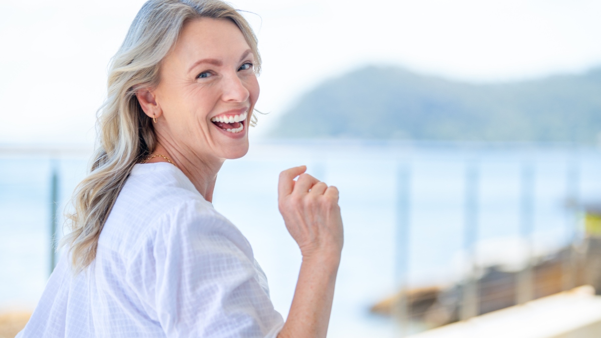 mature woman outside happy with thick hair