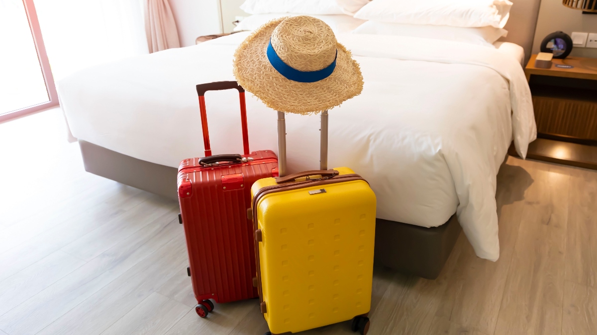 Two suitcases in a hotel room