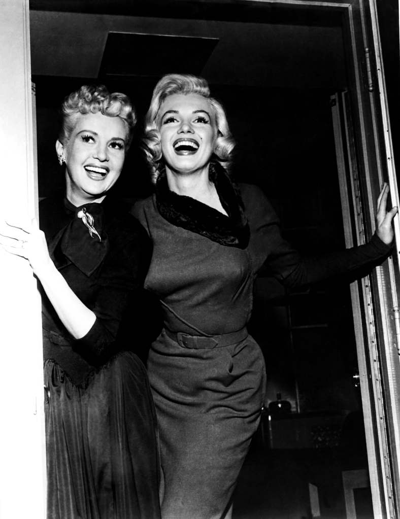 HOW TO MARRY A MILLIONAIRE, from left, Betty Grable, Marilyn Monroe, on-set, 1953