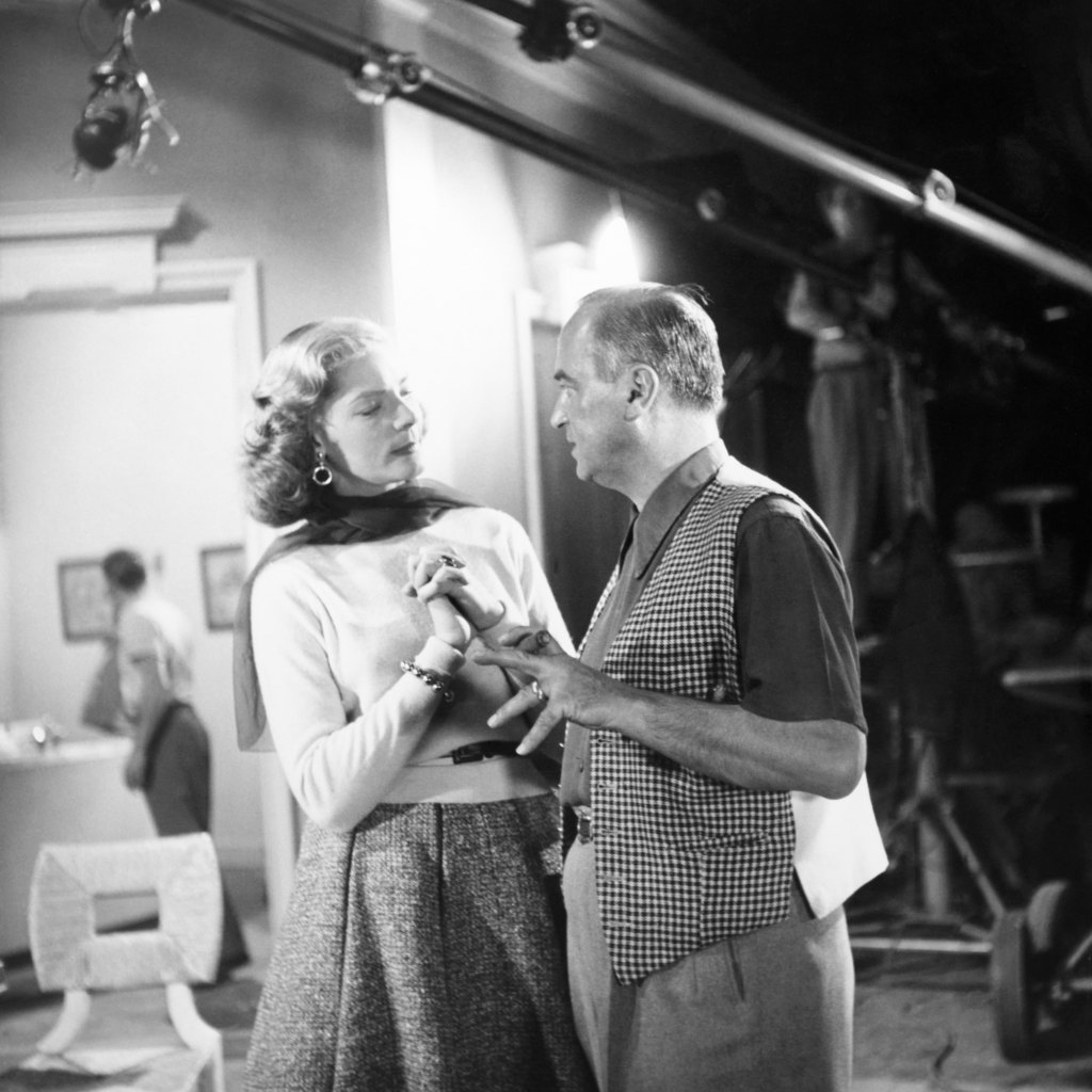 HOW TO MARRY A MILLIONAIRE, from left: Lauren Bacall, director Jean Negulesco on set, 1953
