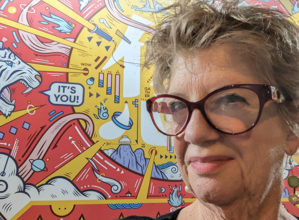 Molly in front of a comic-style background