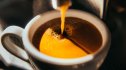 Close-up of a cup of coffee being poured, which contains antioxidants for heart health
